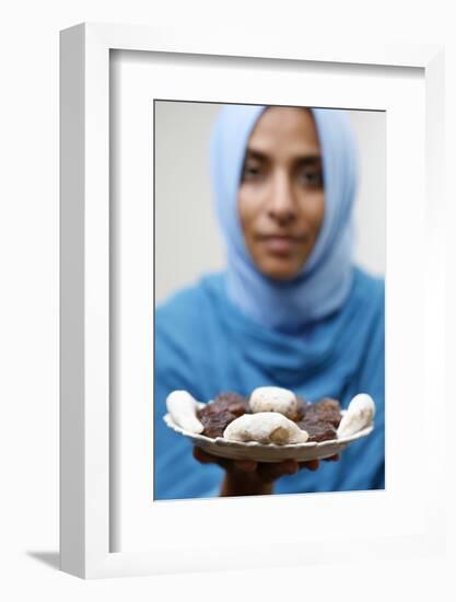 Muslim woman offering Ramadan pastries-Godong-Framed Photographic Print