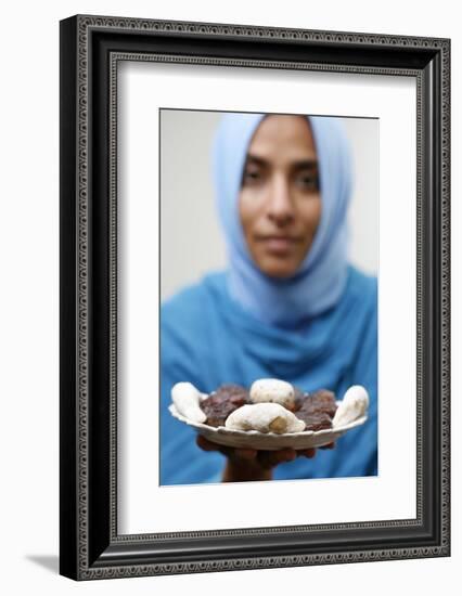 Muslim woman offering Ramadan pastries-Godong-Framed Photographic Print