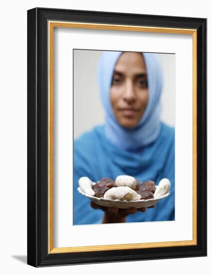 Muslim woman offering Ramadan pastries-Godong-Framed Photographic Print