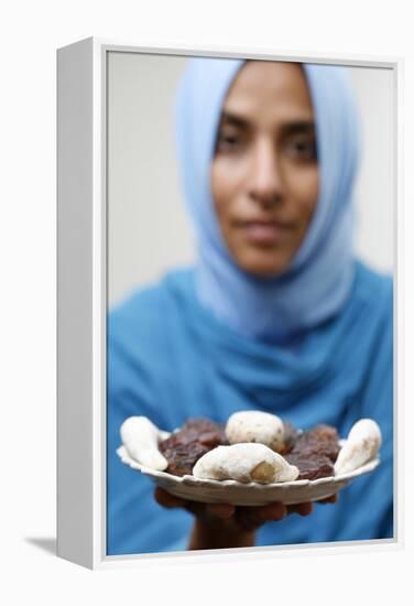 Muslim woman offering Ramadan pastries-Godong-Framed Premier Image Canvas