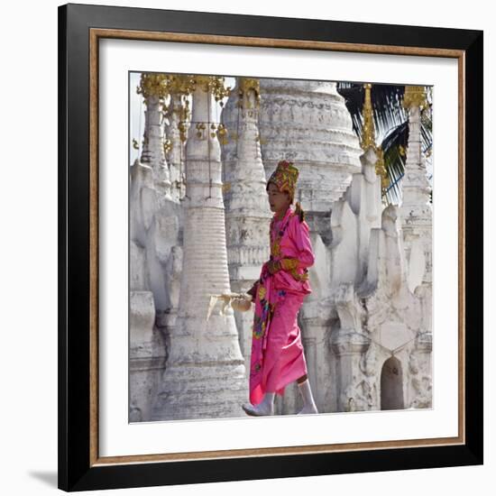 Myanmar, Burma, Lake Inle, A Young Novitiate Passes an Ornate Buddhist Shrine-Nigel Pavitt-Framed Photographic Print