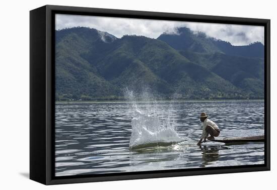 Myanmar, Inle Lake. Man Slaps His Paddle on the Surface of the Lake to Stun the Fish-Brenda Tharp-Framed Premier Image Canvas
