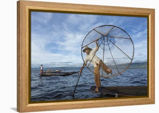 Myanmar, Inle Lake. Young Fisherman Demonstrates a Traditional Rowing Technique-Brenda Tharp-Framed Premier Image Canvas