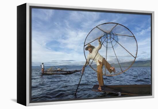 Myanmar, Inle Lake. Young Fisherman Demonstrates a Traditional Rowing Technique-Brenda Tharp-Framed Premier Image Canvas