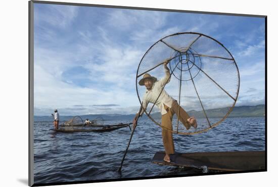 Myanmar, Inle Lake. Young Fisherman Demonstrates a Traditional Rowing Technique-Brenda Tharp-Mounted Photographic Print