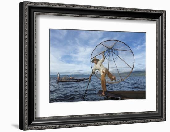 Myanmar, Inle Lake. Young Fisherman Demonstrates a Traditional Rowing Technique-Brenda Tharp-Framed Photographic Print