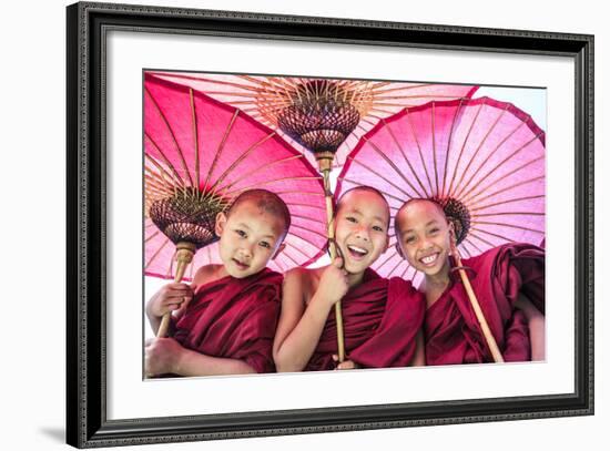 Myanmar, Mandalay Division, Bagan. Portrait of Three Novice Monks under Red Umbrellas (Mr)-Matteo Colombo-Framed Photographic Print