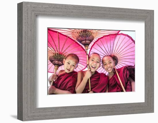 Myanmar, Mandalay Division, Bagan. Portrait of Three Novice Monks under Red Umbrellas (Mr)-Matteo Colombo-Framed Photographic Print