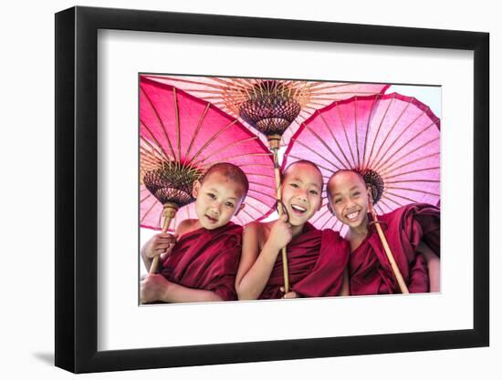 Myanmar, Mandalay Division, Bagan. Portrait of Three Novice Monks under Red Umbrellas (Mr)-Matteo Colombo-Framed Photographic Print