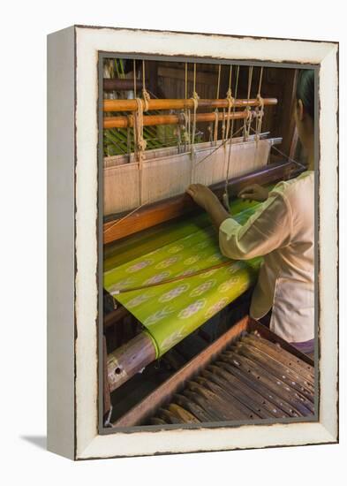 Myanmar. Shan State. Inle Lake. Woman weaving silk at a wooden loom.-Inger Hogstrom-Framed Premier Image Canvas