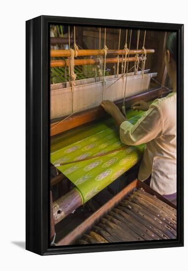 Myanmar. Shan State. Inle Lake. Woman weaving silk at a wooden loom.-Inger Hogstrom-Framed Premier Image Canvas