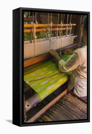 Myanmar. Shan State. Inle Lake. Woman weaving silk at a wooden loom.-Inger Hogstrom-Framed Premier Image Canvas