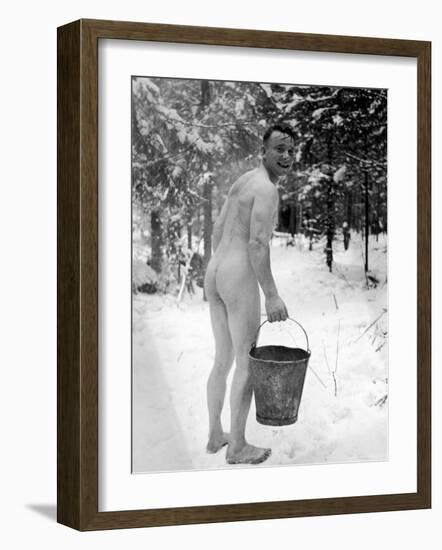 Naked Finnish Soldier Carrying Bucket of Water Back to Friends Enjoying Sauna Bath Nearby-Carl Mydans-Framed Photographic Print