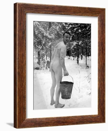 Naked Finnish Soldier Carrying Bucket of Water Back to Friends Enjoying Sauna Bath Nearby-Carl Mydans-Framed Photographic Print