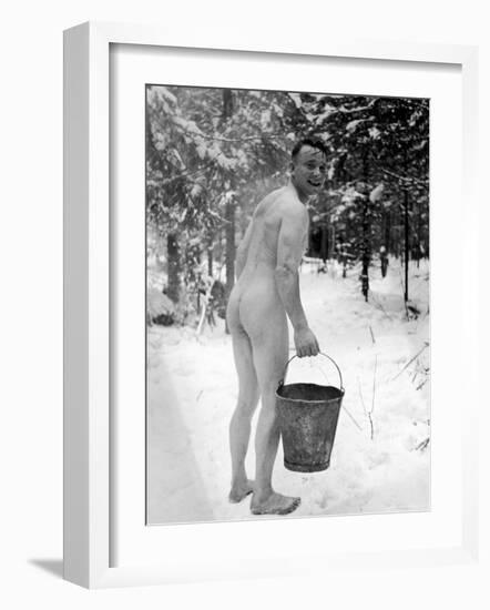 Naked Finnish Soldier Carrying Bucket of Water Back to Friends Enjoying Sauna Bath Nearby-Carl Mydans-Framed Photographic Print