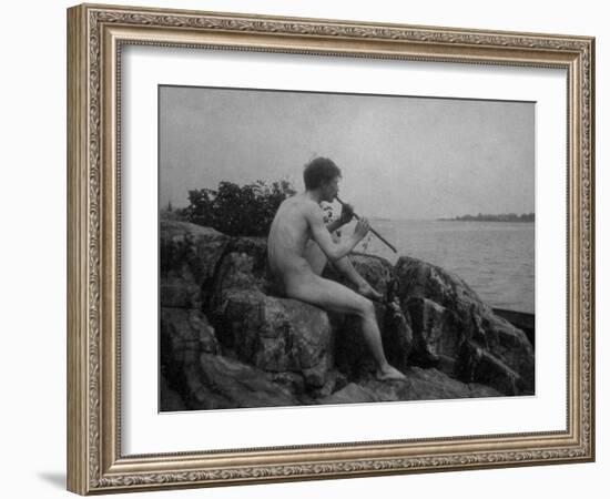 Naked Man Playing His Pipe Photograph-Lantern Press-Framed Art Print
