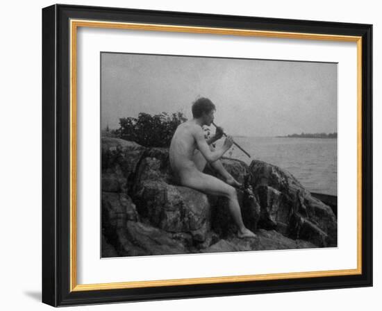 Naked Man Playing His Pipe Photograph-Lantern Press-Framed Art Print