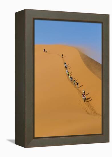 Namibia, Namib-Naukluft National Park, Sossusvlei. Tourists climbing Dune 45.-Ellen Goff-Framed Premier Image Canvas