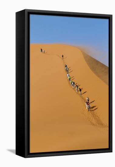 Namibia, Namib-Naukluft National Park, Sossusvlei. Tourists climbing Dune 45.-Ellen Goff-Framed Premier Image Canvas