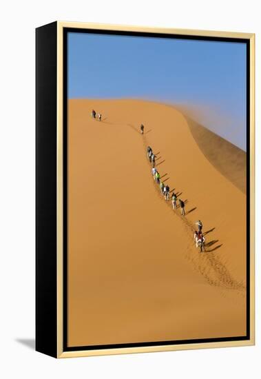 Namibia, Namib-Naukluft National Park, Sossusvlei. Tourists climbing Dune 45.-Ellen Goff-Framed Premier Image Canvas