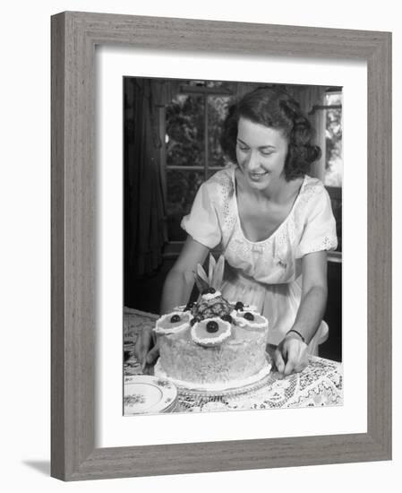 Nancy Drooling over a Pineapple Cake-Nina Leen-Framed Photographic Print