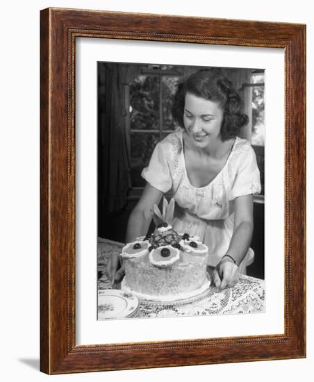 Nancy Drooling over a Pineapple Cake-Nina Leen-Framed Photographic Print