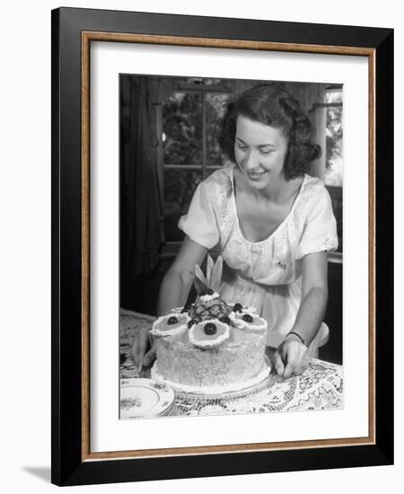 Nancy Drooling over a Pineapple Cake-Nina Leen-Framed Photographic Print