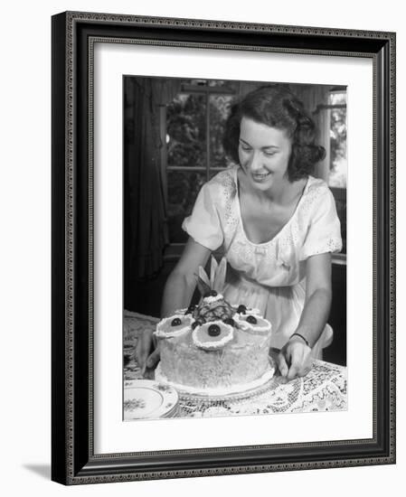 Nancy Drooling over a Pineapple Cake-Nina Leen-Framed Photographic Print