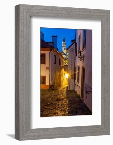 Narrow cobblestone streets at dusk with Castle Tower in historic Cesky Krumlov, Czech Republic.-Chuck Haney-Framed Photographic Print