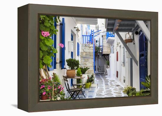 Narrow street, whitewashed buildings with blue paint work, flowers, Mykonos Town (Chora), Mykonos,-Eleanor Scriven-Framed Premier Image Canvas