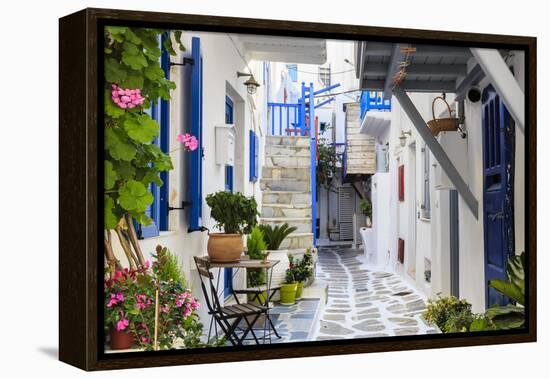 Narrow street, whitewashed buildings with blue paint work, flowers, Mykonos Town (Chora), Mykonos,-Eleanor Scriven-Framed Premier Image Canvas