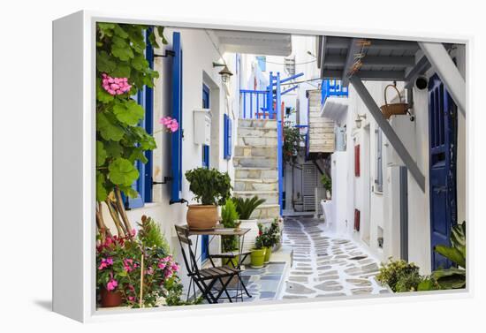 Narrow street, whitewashed buildings with blue paint work, flowers, Mykonos Town (Chora), Mykonos,-Eleanor Scriven-Framed Premier Image Canvas