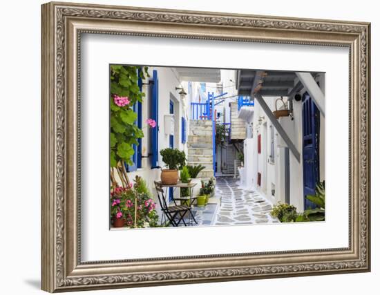 Narrow street, whitewashed buildings with blue paint work, flowers, Mykonos Town (Chora), Mykonos,-Eleanor Scriven-Framed Photographic Print