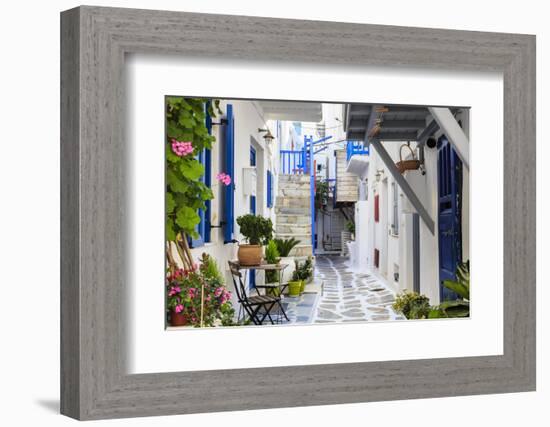 Narrow street, whitewashed buildings with blue paint work, flowers, Mykonos Town (Chora), Mykonos,-Eleanor Scriven-Framed Photographic Print