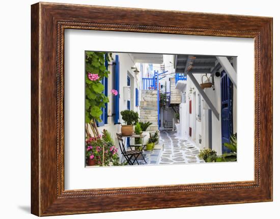 Narrow street, whitewashed buildings with blue paint work, flowers, Mykonos Town (Chora), Mykonos,-Eleanor Scriven-Framed Photographic Print