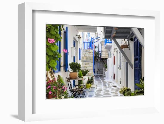 Narrow street, whitewashed buildings with blue paint work, flowers, Mykonos Town (Chora), Mykonos,-Eleanor Scriven-Framed Photographic Print