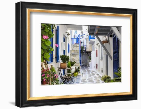 Narrow street, whitewashed buildings with blue paint work, flowers, Mykonos Town (Chora), Mykonos,-Eleanor Scriven-Framed Photographic Print