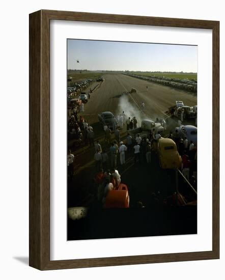 National Hot Rod Association's National Opening Drag Race Held at the Orange County Airport-Ralph Crane-Framed Photographic Print