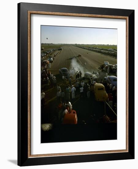 National Hot Rod Association's National Opening Drag Race Held at the Orange County Airport-Ralph Crane-Framed Photographic Print