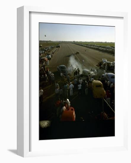 National Hot Rod Association's National Opening Drag Race Held at the Orange County Airport-Ralph Crane-Framed Photographic Print