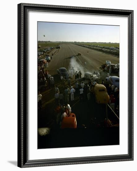 National Hot Rod Association's National Opening Drag Race Held at the Orange County Airport-Ralph Crane-Framed Photographic Print