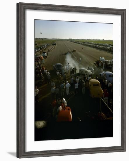 National Hot Rod Association's National Opening Drag Race Held at the Orange County Airport-Ralph Crane-Framed Photographic Print