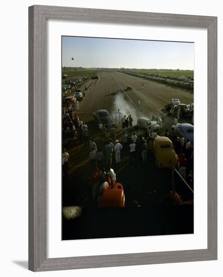 National Hot Rod Association's National Opening Drag Race Held at the Orange County Airport-Ralph Crane-Framed Photographic Print