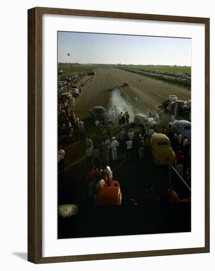 National Hot Rod Association's National Opening Drag Race Held at the Orange County Airport-Ralph Crane-Framed Photographic Print