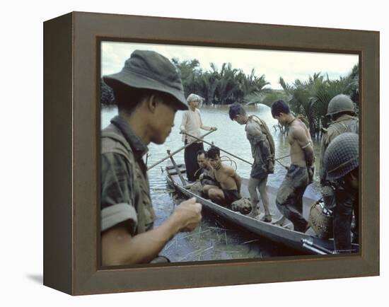 Nationalist S Vietnamese Soldiers Loading Viet Cong Prisoners Onto Canoe Like Boats in Mekong Delta-Larry Burrows-Framed Premier Image Canvas