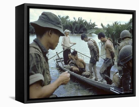 Nationalist S Vietnamese Soldiers Loading Viet Cong Prisoners Onto Canoe Like Boats in Mekong Delta-Larry Burrows-Framed Premier Image Canvas