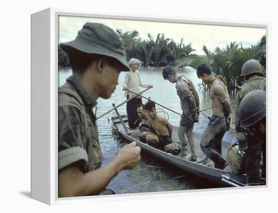 Nationalist S Vietnamese Soldiers Loading Viet Cong Prisoners Onto Canoe Like Boats in Mekong Delta-Larry Burrows-Framed Premier Image Canvas