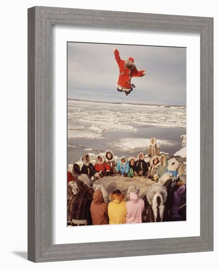 Native Alaskans Playing a Game of Nulukatuk, in Which Individals are Tossed into the Air-Ralph Crane-Framed Photographic Print