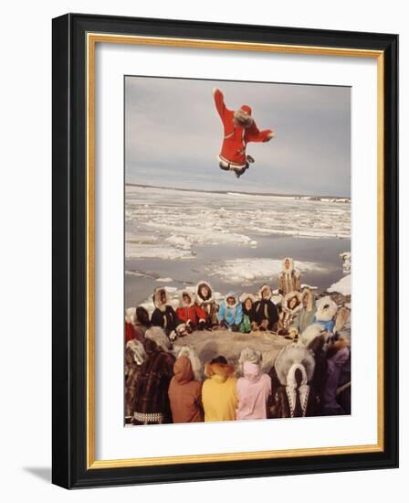 Native Alaskans Playing a Game of Nulukatuk, in Which Individals are Tossed into the Air-Ralph Crane-Framed Photographic Print