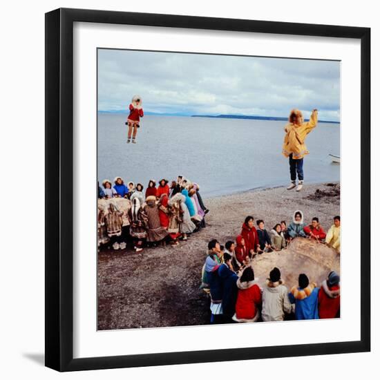 Native Alaskans Playing a Game of Nulukatuk, in Which Individals are Tossed into the Air-Ralph Crane-Framed Photographic Print